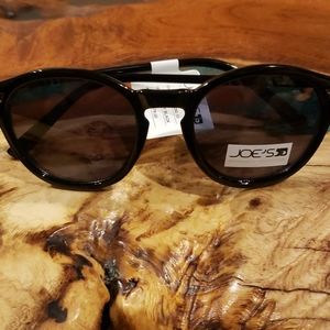 Joe's shiny black sunglasses